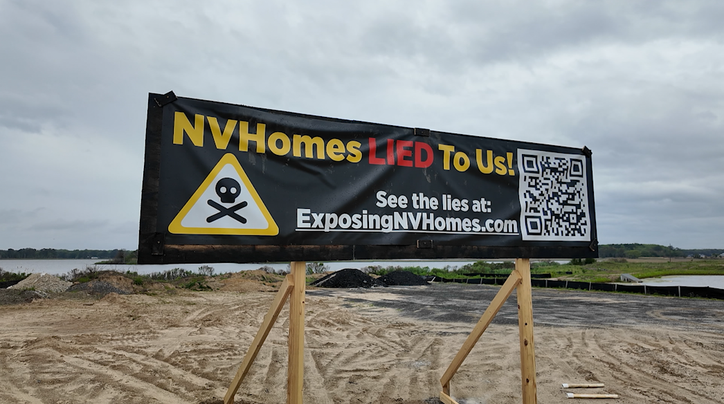 Sign promoting exposingnvhomes.com